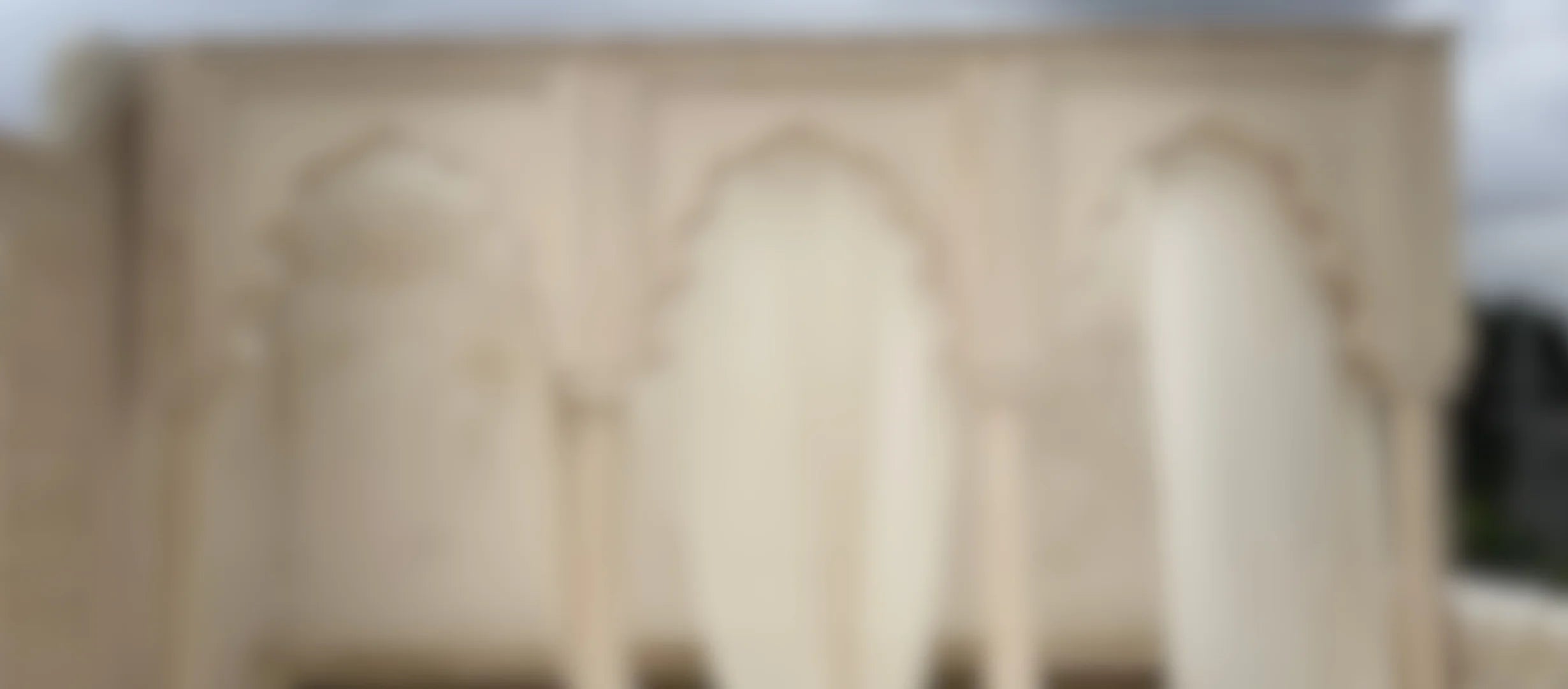 Blurred image of a arc with decorative carvings