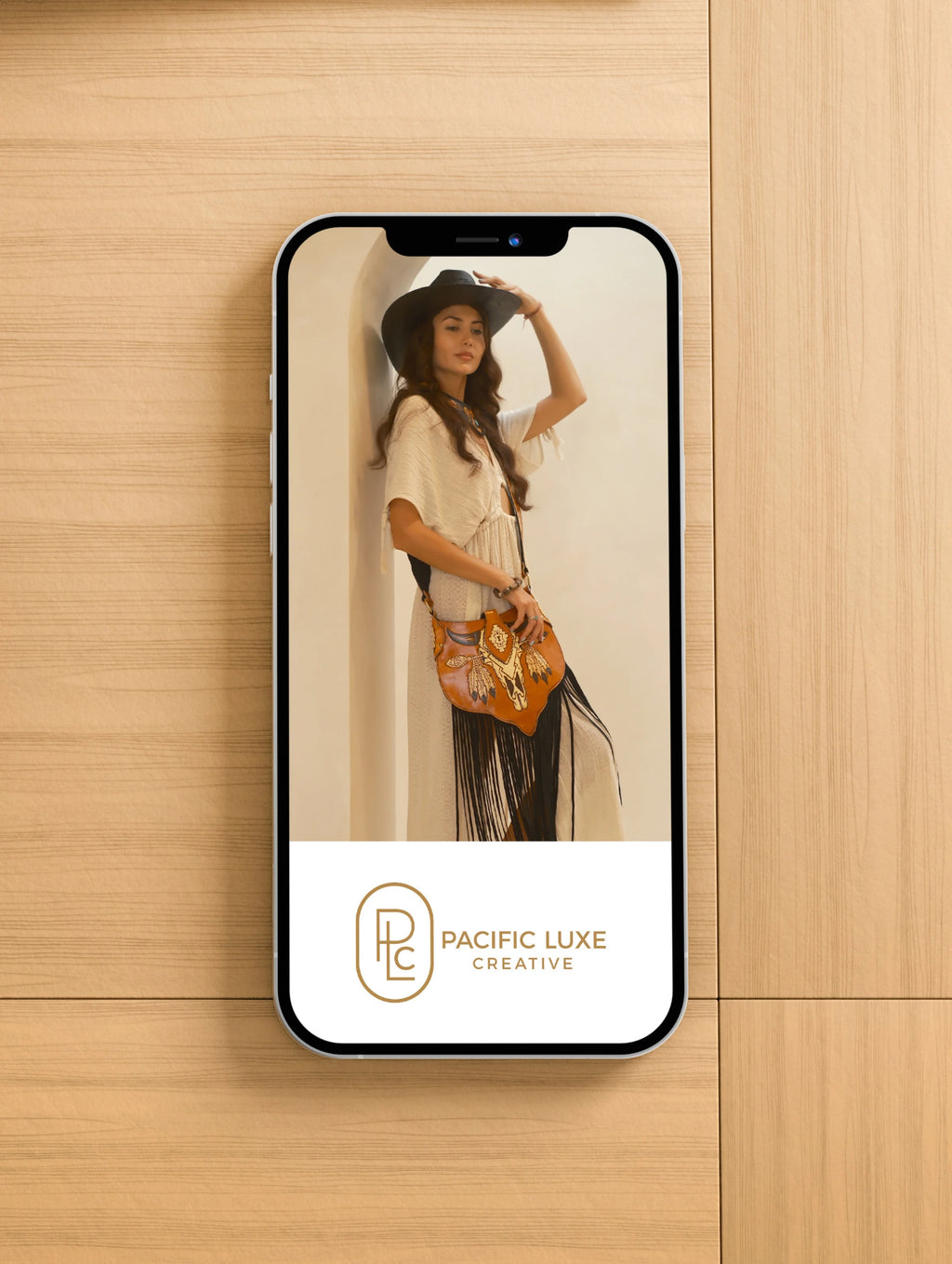 Creative Perth-inspired imagery by Pacific Luxe Creative mobile display featuring woman in hat and handbag under natural canopy glow.
