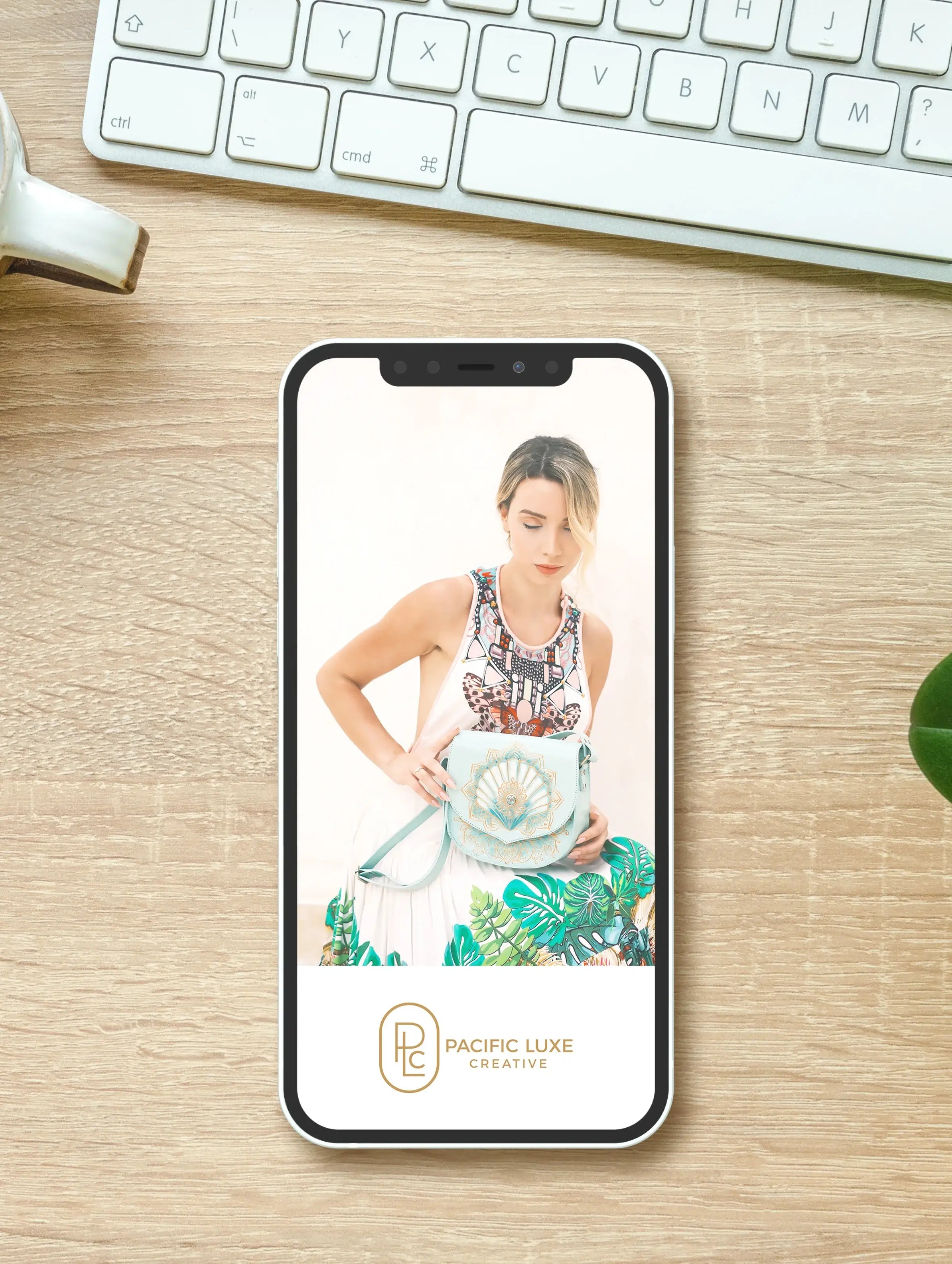 Luxe brand photography by Pacific Luxe Creative featuring mobile display on timber workspace with Perth-inspired elegance.