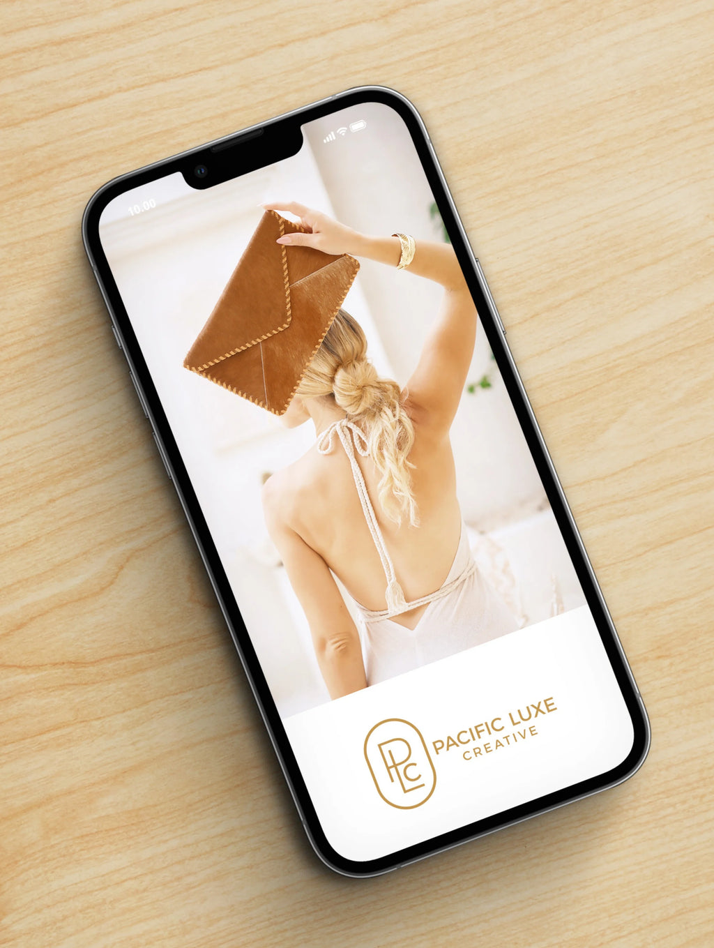 Creative Bali-inspired imagery phone showcasing Pacific Luxe Creative advertisement under gentle Karri Sapling light and organic texture.