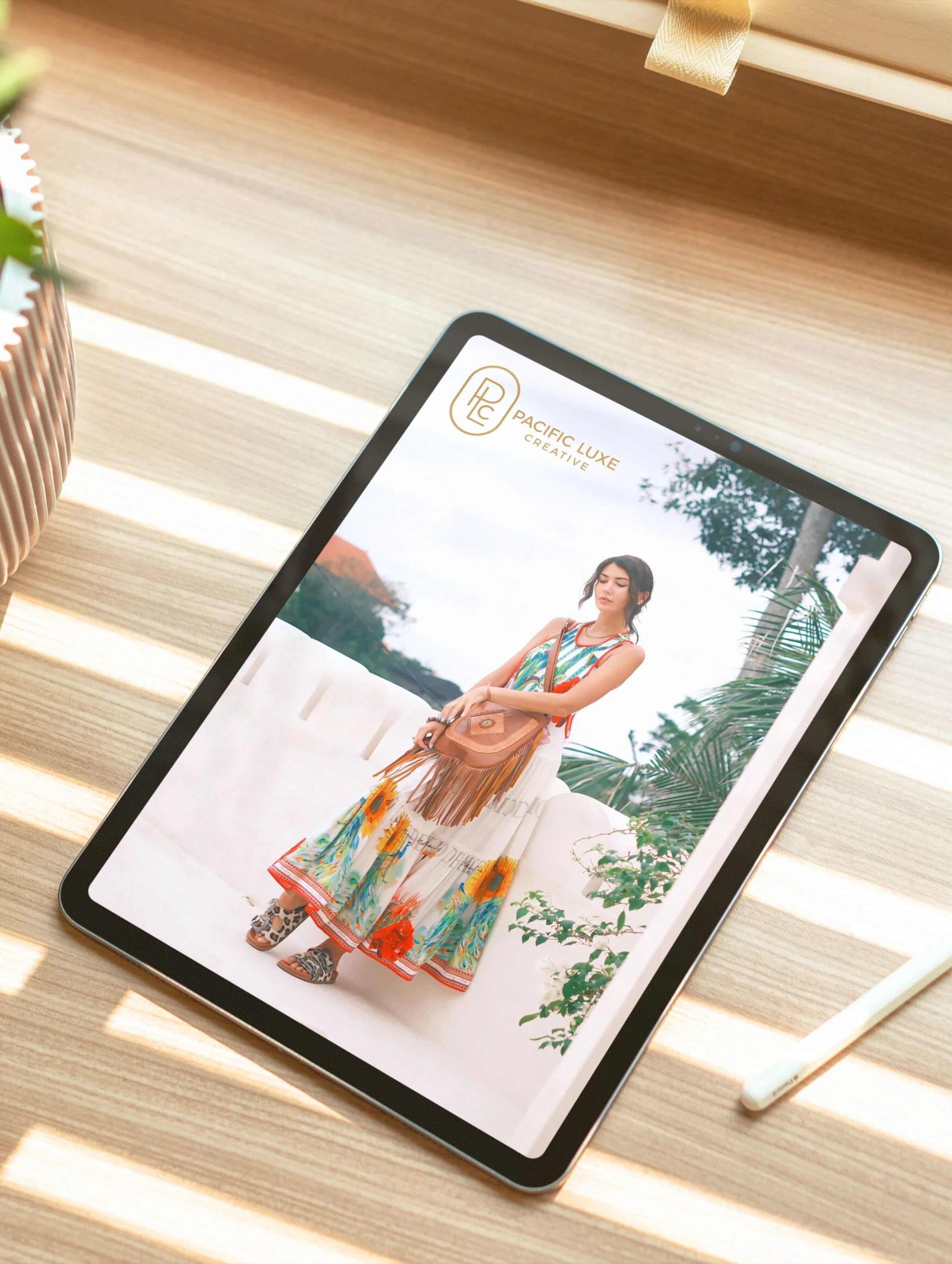 Elegant product photography from Pacific Luxe Creative colorful island-inspired imagery on tablet styled with plant details and Bali luxury aesthetic with palm breeze