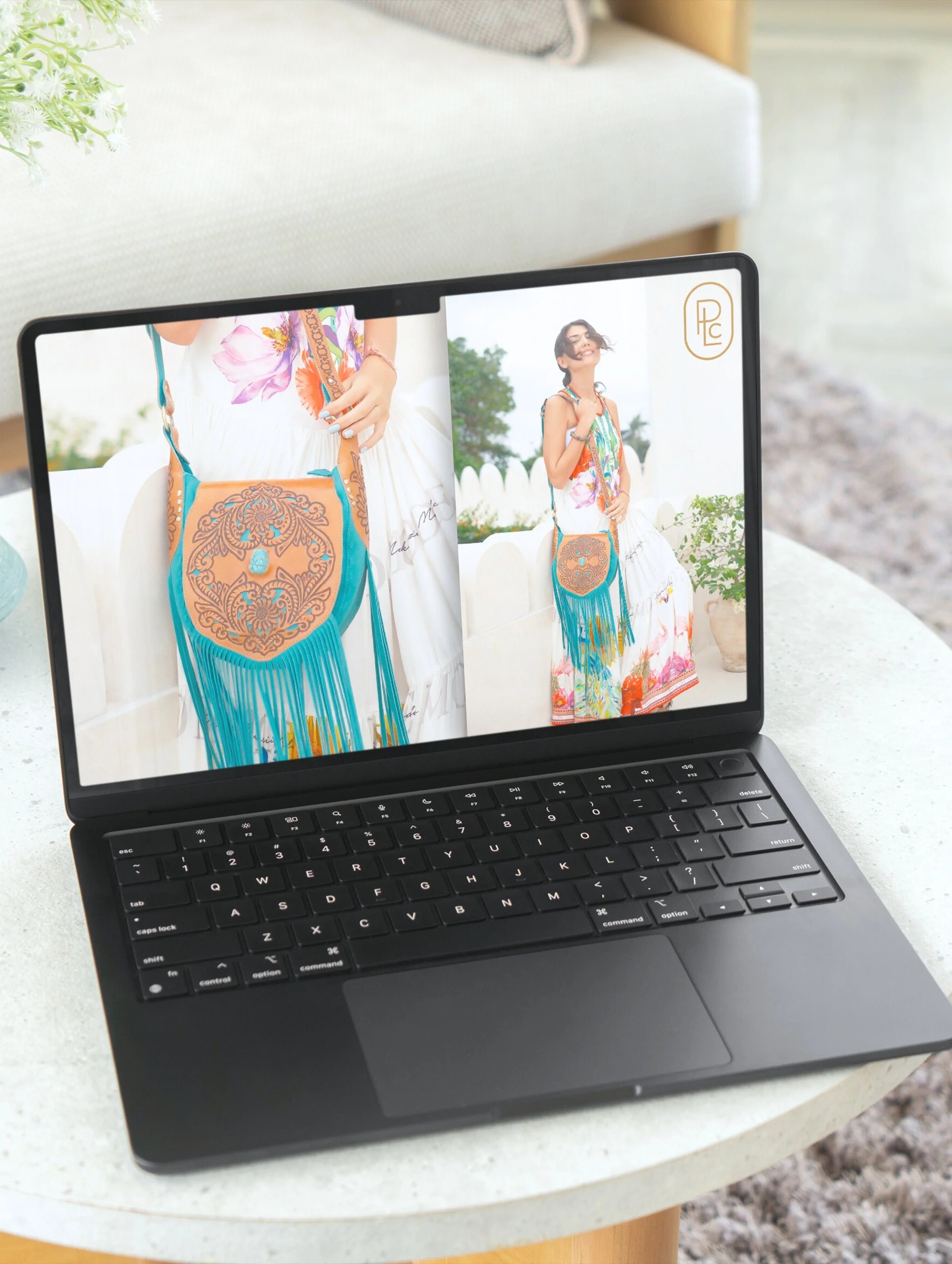Pacific Luxe Creative brand photography laptop displaying a woman in a dress with a decorative bag on a white surface, glowing with Bali palm breeze luxury.