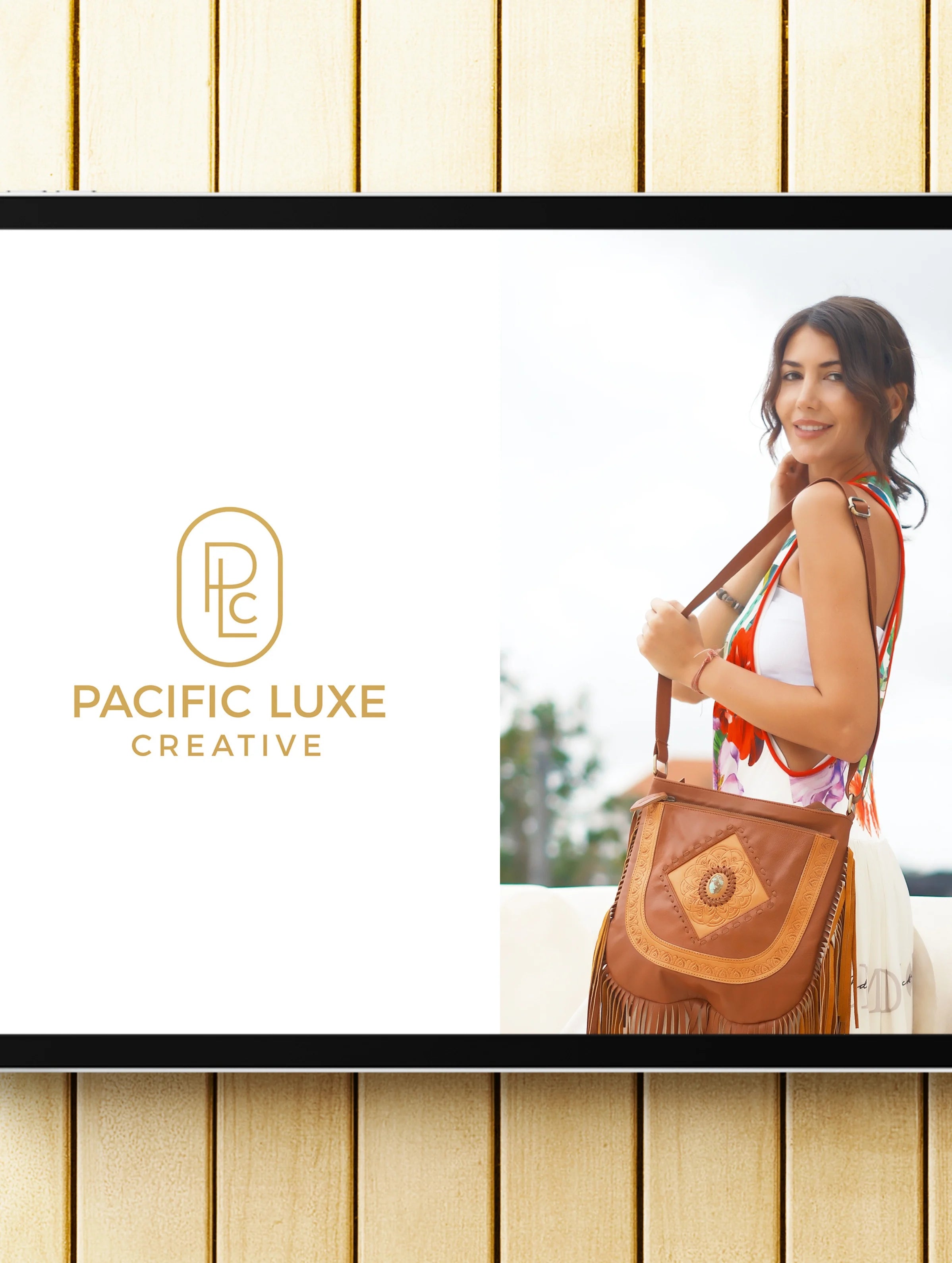 Luxury handbag imagery by Pacific Luxe Creative woman holding brown accessory under serene Paradise Shore light and effortless island glow.